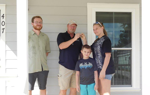 Residents receive keys to their new home in Century, funded through the SHIP program to replace their home that was damaged by the February 2016 tornado.