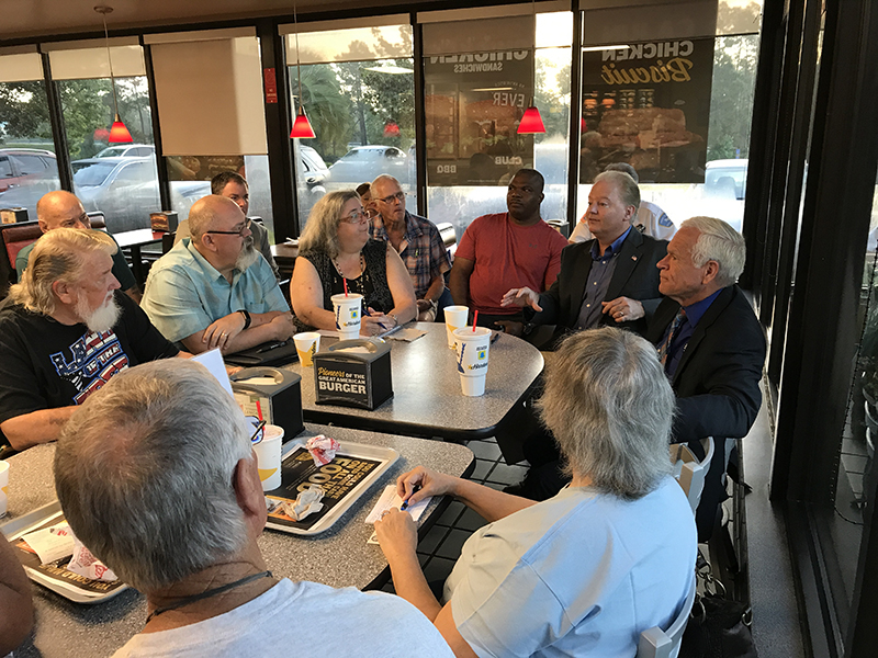 Commissioner Jeff Bergosh meets with residents during the August Coffee with the Commissioner at Hardee's on Wilde Lake Boulevard.
