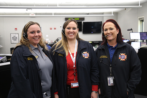 Dispatchers 1 Three Emergency Communications dispatchers stand in the 911 call center at Escambia County Public Safety.