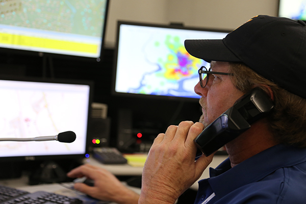 A 911 dispatcher takes a call at Escambia County Public Safety.
