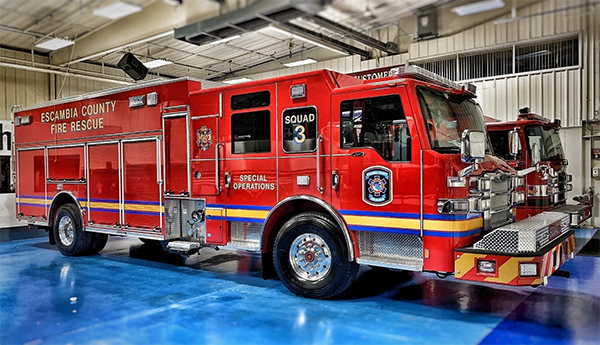 The new Escambia County Fire Rescue Squad 3 apparatus parked in the bay of Station 3