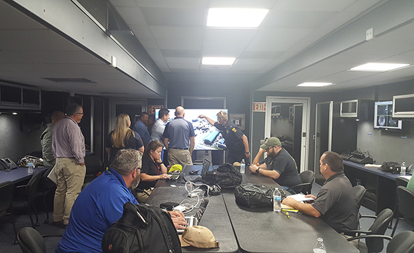 Escambia County staff and other emergency responders work  in the Mobile Command Center in Bay County, Florida.
