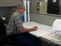 Survey Staff Member Working on Plat Review